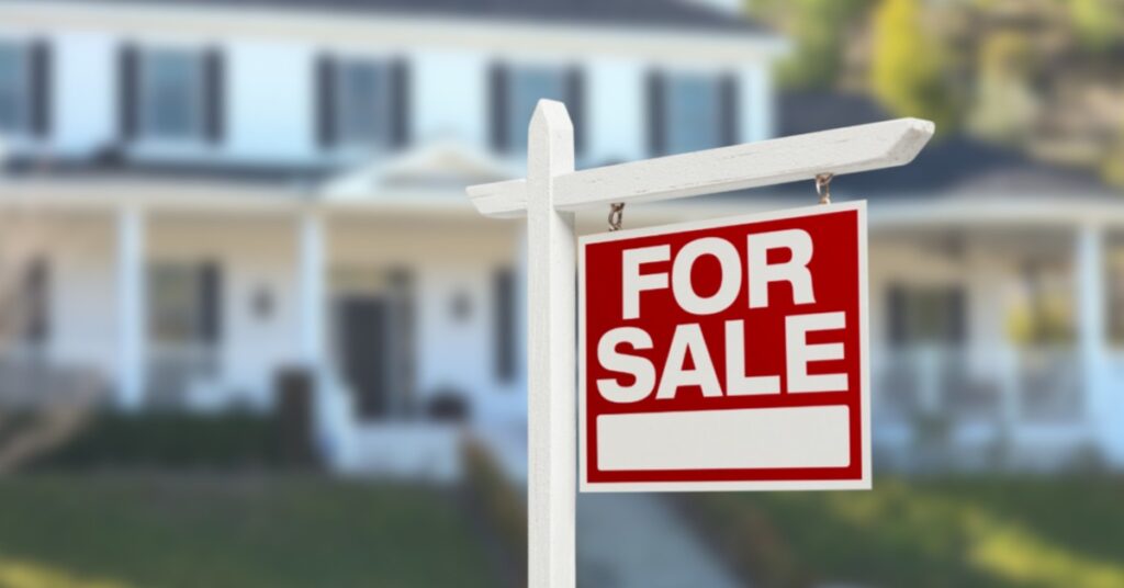 a for sale sign in front of a sedona home