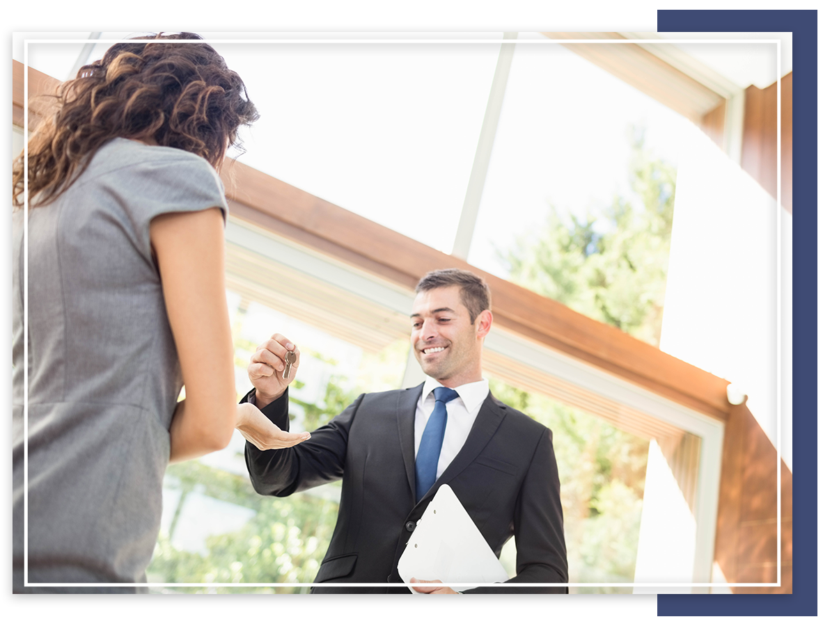 real estate agent handing over the keys to the client