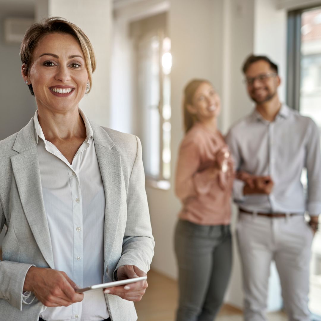 Real estate agent viewing a home with a couple.