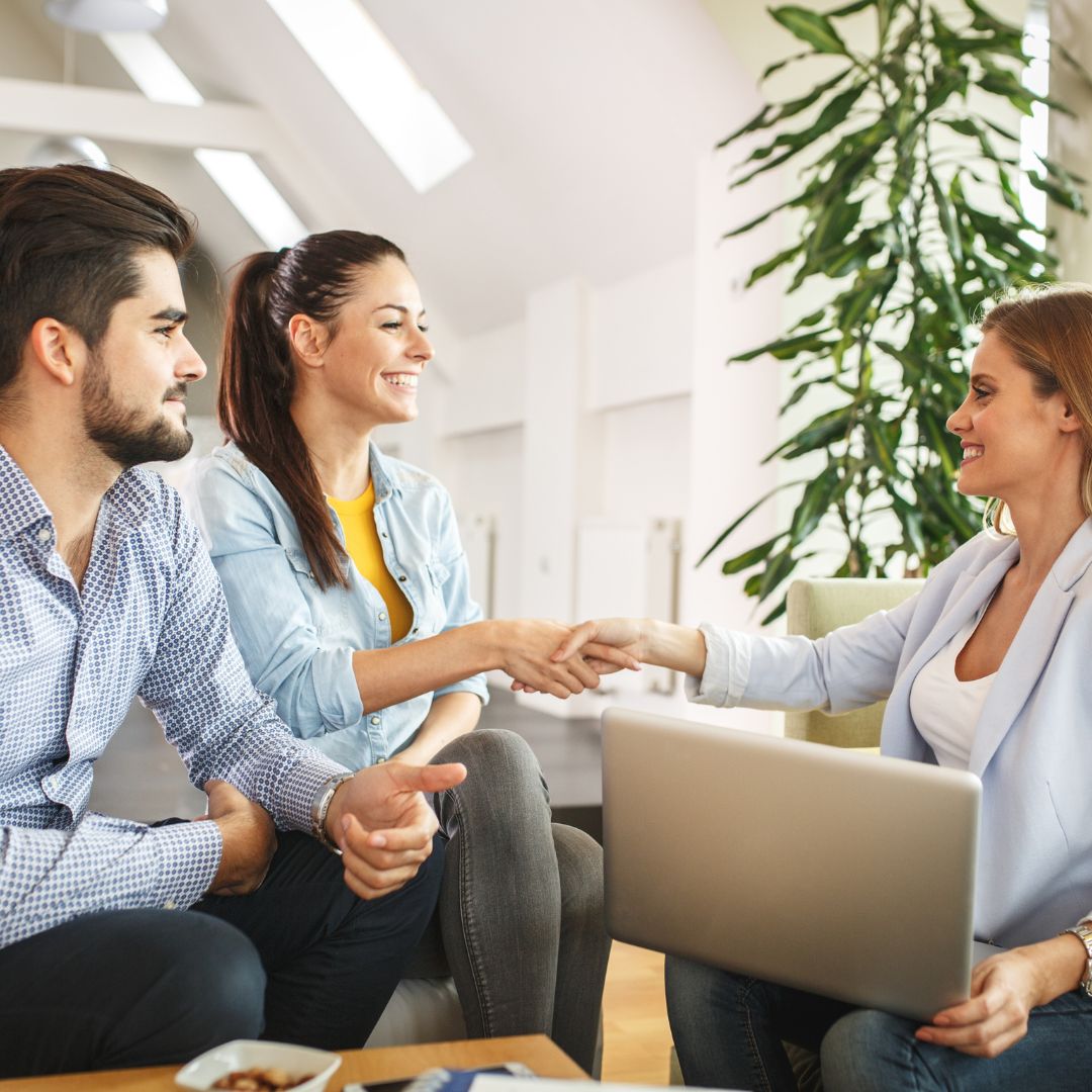 Couple meeting with real estate agent