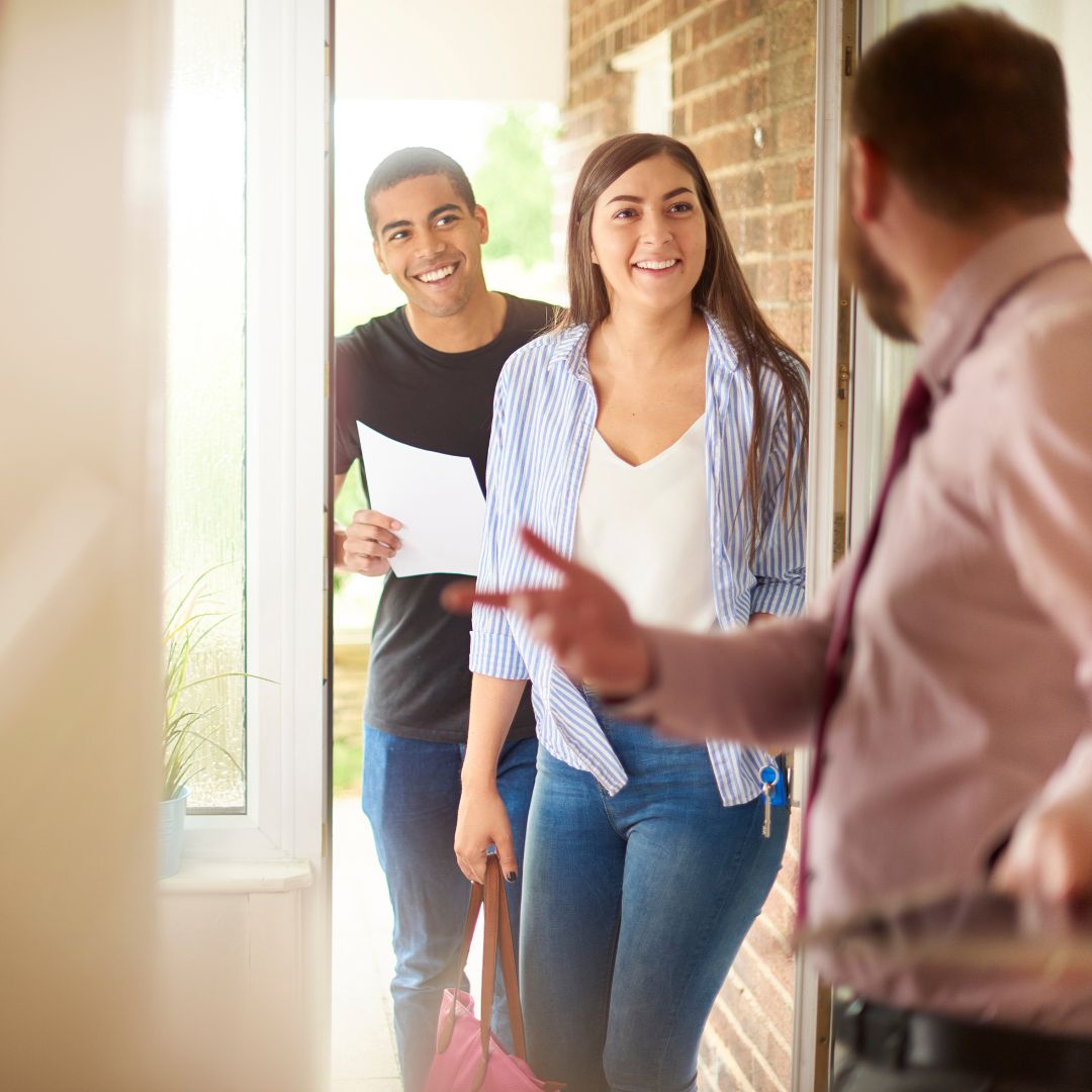 couple arriving at an open house