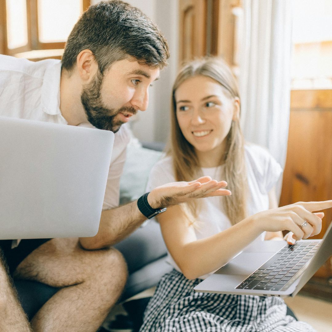 img of a couple looking at the computer
